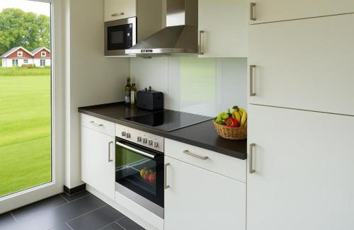 Nordhorn Casa | Dock 61 - tolles Ferienhaus für bis zu 4 Personen mit Kaminofen und Sauna - Haustiere herzlich willkommen, direkt am Wasser gelegen