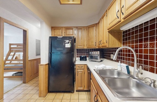 Jackson Condominio | Dog-Friendly Condo with Patio, Wood Stove, Full Kitchen, W/D, & Free WiFi
