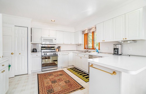 Arcadia Casa | Dog-friendly, lake view home with three season room, fireplace, video projector