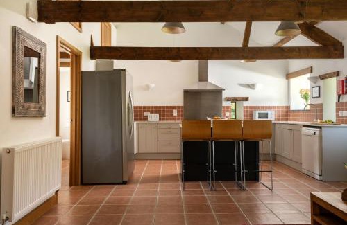 Widegates Casa | East Trenean Farm Cottages -4 Luxury Cornish Cottages sleeping 20 with hot tubs, private gardens, rural views and EV facilities