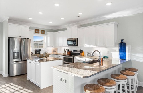 Sunset Beach Casa | Easy Breezy is a stunning 4 bedroom, 4 bathroom house with a private pool and elevator