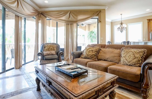 St. Tropez Casa | Elegant coastal villa with spacious patio, pool, hot tub, free WiFi & central AC