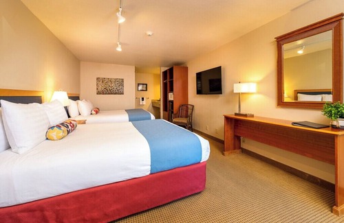 Leavenworth Hotel | Enjoy easy walking access to all Leavenworth has to offer after a relaxing night in our room with two queen beds.