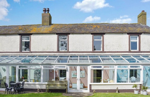 Beckfoot Cabaña | Escape to The Stables, a charming two-bedroom cottage near Silloth, Cumbria.
