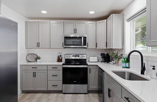 Burley Casa | Experience elevated comfort in this thoughtfully designed retreat. Featuring two inviting bedrooms, a fully equipped kitchen, and serene details, it blends simplicity with style for a clean, welcoming stay.