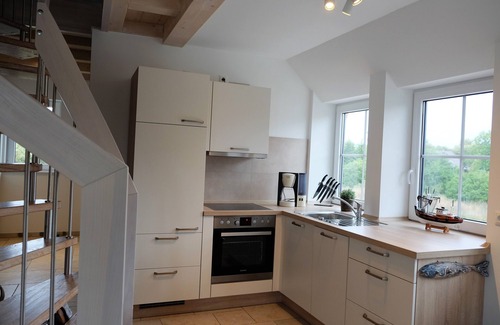 Dranske Apartamento | Fantastic vacation apartment near the beach with fireplace, quiet location