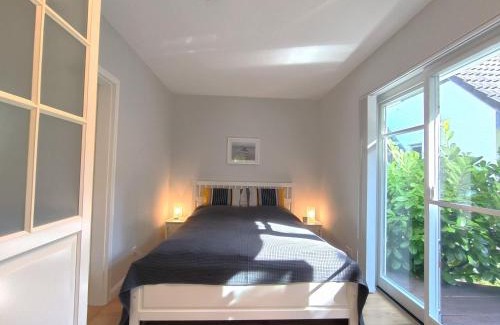 Tarp Casa | Ferienhaus Inger - stilvolles und modernes Ferienhaus mit Terrasse und Gartennutzung