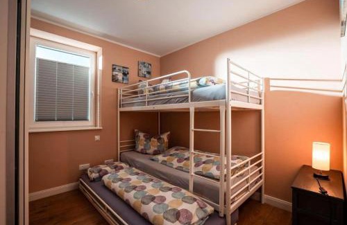 Rettin Apartamento | "Ferienhaus Viereck" - inkl. Bettwäsche, Handtücher und Strandnähe - idealer Wohlfühlort für Familien und Wassersportler