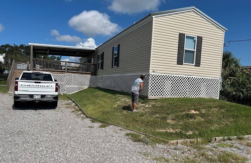 Hackberry Casa | Fishing camp with boat stall cleaning table three bedroom two bath