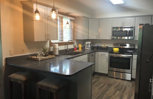 Mount Ida Condominio | Forest view, log-sided two bedroom, two bath condo on Lake Ouachita. by RedAwning