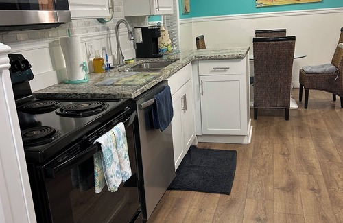 Vista Del Mar Casa | Fully remodeled, adorable coastal canal house on a spacious corner lot.