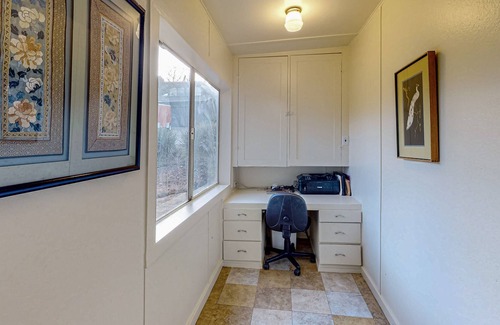 Black Point-Green Point Casa | Gorgeous river view home with wood stove, sauna, patio, fitness room, & kitchen