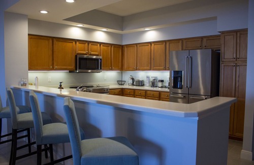 Burnt Store Marina Condominio | GRAND ISLES III, 5th Floor Condo w/ an AMAZING SUNSET VIEW in a Tropical Setting