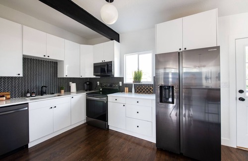 Lamar Heights Area Casa | Group friendly Denver home with hot tub, fire pit, large dining, & big backyard.
