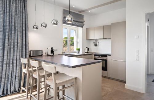 Kletkamp Apartamento | GUT KLETKAMP "Mühlenhof 5" - Ruhige Ferienwohnung mit 3 Schlafzimmern I Terrasse mit See- & Naturblick I Gemeinschaftsgarten I 15 Min zur Ostsee I Küche I Parkplatz I Waschmaschine I WLAN