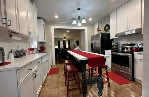 Harlandale Casa | Halloween House sugar skull corn hole, life size Checkers, Horseshoe, Foosball