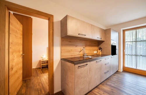 Racines Apartamento | Apartamento vacacional "Parigger Apt Enzian" con vistas a la montaña, jardín comunitario y wifi
