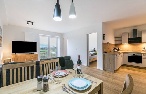 Husbyholz Apartamento | Apartamento vacacional 'Zum Krähenholz 9' con jardín comunitario y Wi-Fi