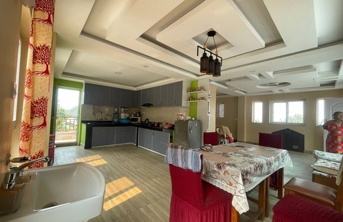 Kirtipur Casa | Home is located on the side of a mountain near a famous Buddhist monastery.