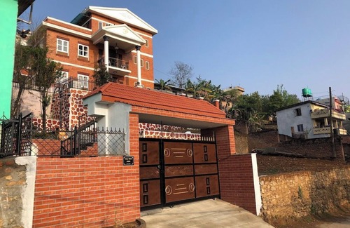 Kirtipur Casa | Home is located on the side of a mountain near a famous Buddhist monastery.