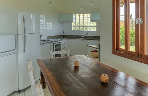Barra de Ibiraquera Casa | casa en la playa con vistas espectaculares y un gran jardín