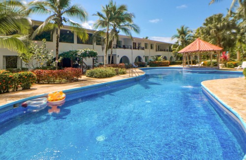 Damas Condominio | Ideally Located Tropical Escape W/ Lush Gardens, & Shared Pool!