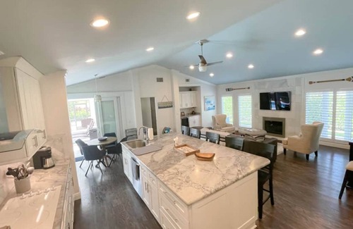 Palm River Estates Casa | Immaculately maintained 4 bd 3 ba home feat private pool on LaPlaya golf course.