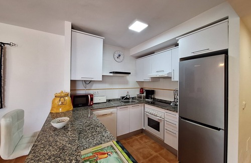 Palomares Apartamento | JP Bajo - Alquiler vacacional con jardín privado y parking