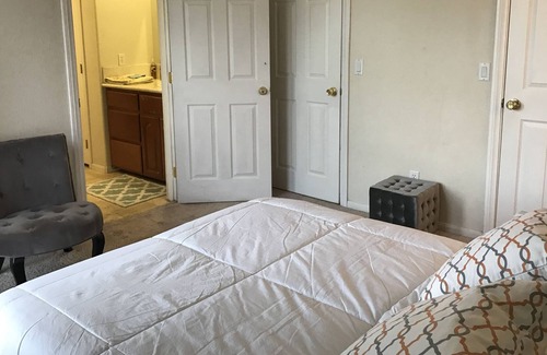 Hesperia Casa | Lake and mountain view bedroom in a custom home Hesperia