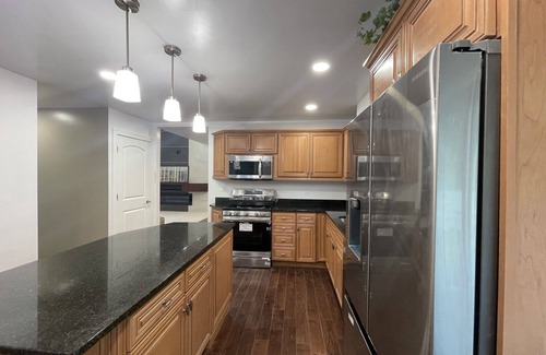 Racine Casa | Lake Michigan Retreat. Spacious 4-bedroom home on wooded lot across from lake.
