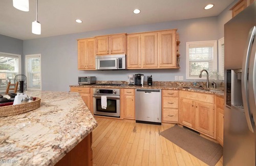 Glenn Haven Shores Casa | Large Family Home in South Haven - Private Lake Access, Hot Tub, Sunroom & Patio