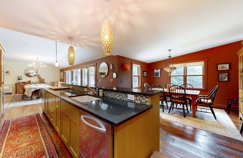 Warren Casa | Luxe custom home with hot tub, game room, & beautiful garden
