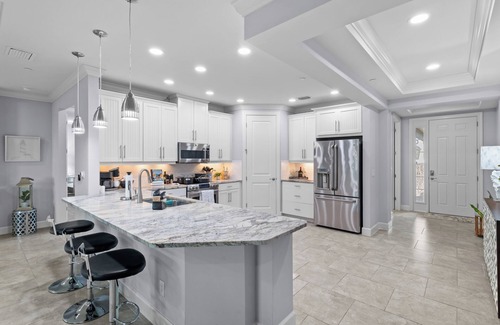 Naples Condominio | Luxury 1st Floor Coach Home, Esplanade Golf, Tennis, Pickleball & Pools