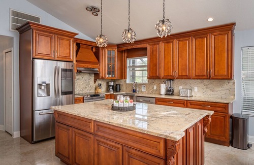 Dunedin Casa | Luxury 5 Bedroom Dunedin home ~ TWO full kitchens, heated pool, hot tub!