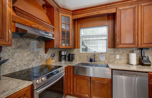 Dunedin Casa | Luxury 5 Bedroom Dunedin home ~ TWO full kitchens, heated pool, hot tub!