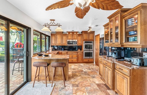 Cocoa Isles Casa | Luxury Canalfront Home w/ Heated Pool, Game Room, Boat & Jet Ski Lifts