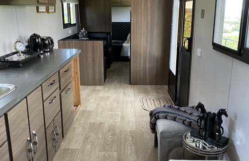 Oberon Casa | Luxury Caravan, Complimentary welcome cheese platter & a bottle of wine.
