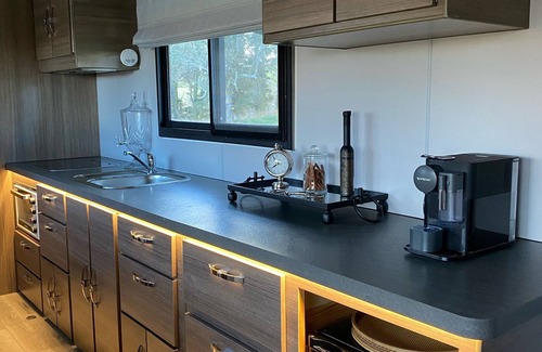 Oberon Casa | Luxury Caravan, Complimentary welcome cheese platter & a bottle of wine.