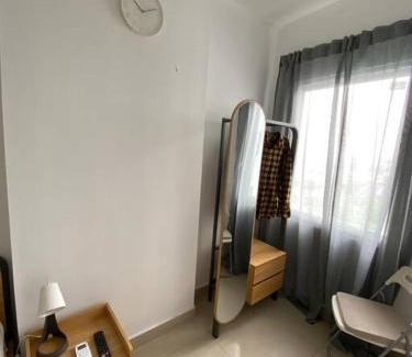 Tangerang Apartamento | Minimalist room at The Nest Apartment by Popobella Near Puri Indah West Jakarta