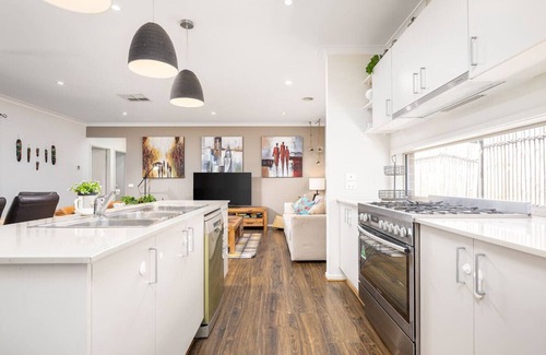 Clyde North Casa | Modern Family Friendly Retreat Home with Sunroom