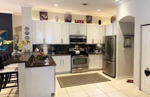 Lake Ida Shores Casa | Modern Oasis in Delray Beach: Steps from the Sand