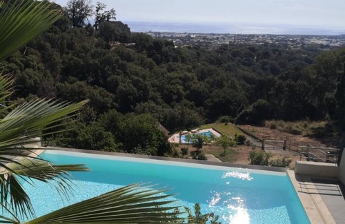 Furiani Apartamento | Modern studio with magnificent sea view in a quiet, leafy setting