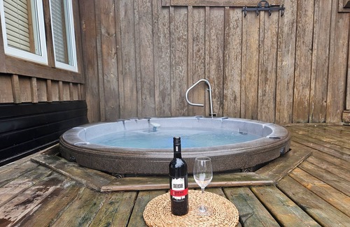 Unorganized Centre Parry Sound Cabaña | Cozy waterfront cottage, sandy beach front, sunken hot tub, with putting green.