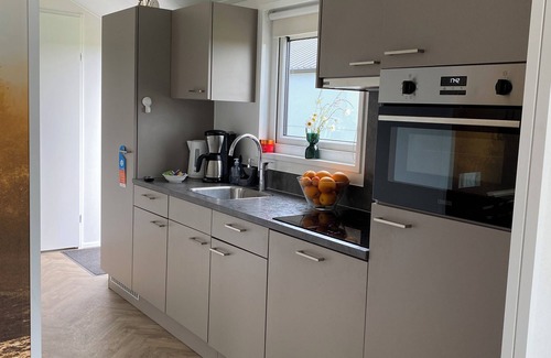 Municipality of Kampen Casa | NEW Elegant Holiday Home Chalet on a Lake in Kampen, Netherlands Boat waterfront