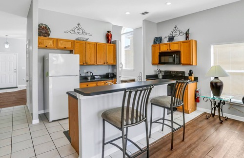 Marbella Casa | Palm-lined home with enclosed pool, game room, washer/dryer & AC - dog-friendly