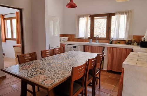 Beniarbeig Casa | Peaceful and relaxing rustic house with a spacious garden surrounded by trees.