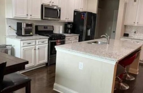 Buford Casa | Peaceful Family Retreat, Cozy Fireplace, Ping Pong, & Fenced Backyard Oasis