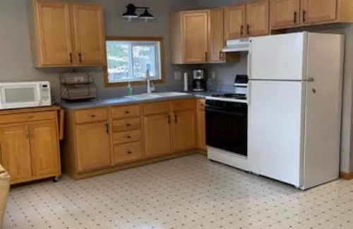 Pentwater Casa | Pentwater River Frontage Overlooking 100s of Wooded Acres