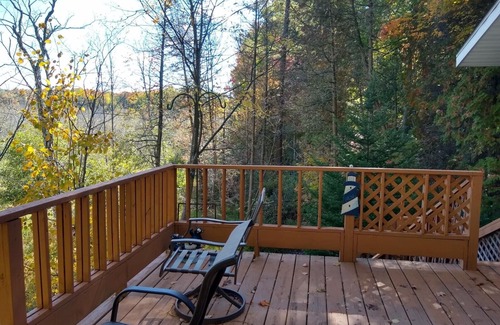 Pentwater Casa | Pentwater River Frontage Overlooking 100s of Wooded Acres