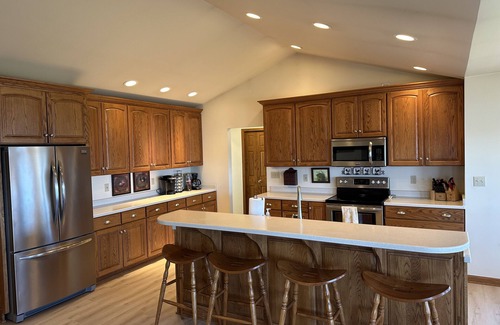 Ludington Casa | Private Hamlin Lake Water Front Cottage Perfect Family Retreat